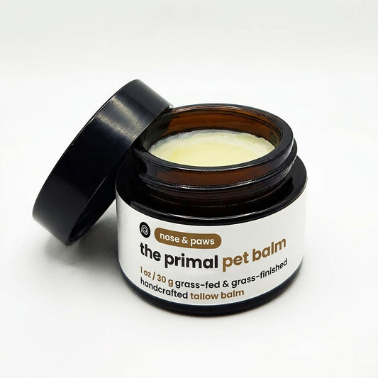 Tallow paw and nose balm for dogs and cats in an amber glass jar by The Primal